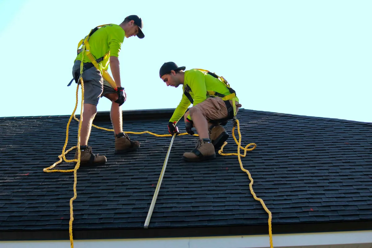 Yarco Roofing technician repairing damaged shingles on a North Alabama roof